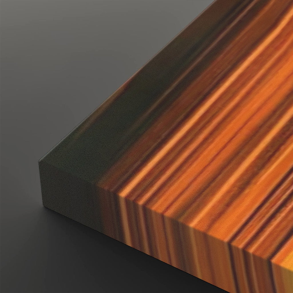 A close-up of a rectangular block with a striped woodgrain pattern in warm orange, brown, and amber tones, shown against a dark gray background.