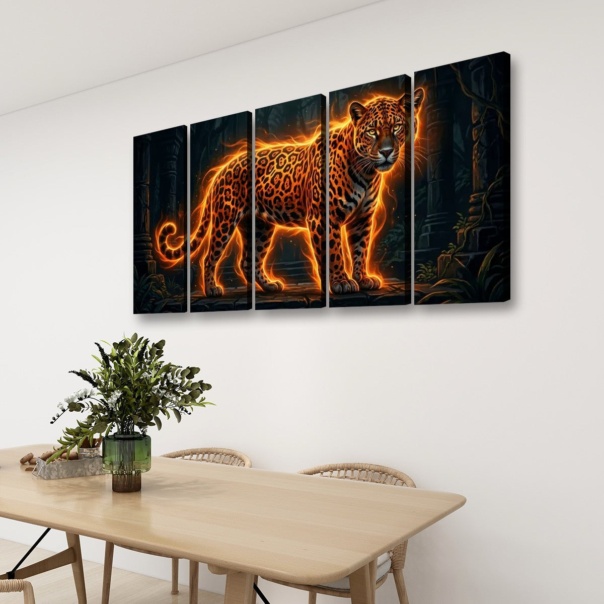 A four-panel canvas wall art set depicting a glowing orange leopard against a dark jungle background, displayed on a white wall above a wooden dining table with chairs and a plant.