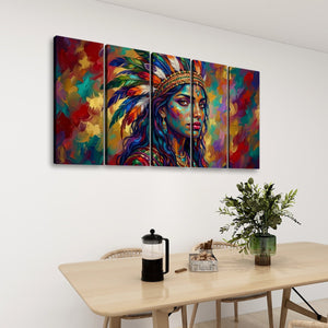 A four-panel canvas wall art set depicting a colorful, textured portrait of a woman in a feathered headdress, displayed on a white wall above a dining table with a plant and coffee maker.