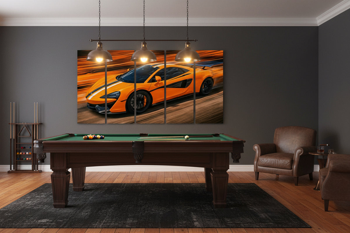 A five-panel canvas wall art set depicting a bright orange sports car with black racing stripes on a blurred orange background, displayed above a wooden dining table in a modern room setting.