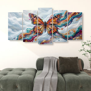 A five-panel canvas wall art set depicting a colorful Monarch butterfly with swirling abstract paint strokes, displayed above a green sofa in a living room setting.