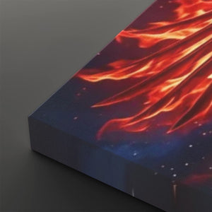 A close-up of a rectangular canvas or print showing a dramatic fiery scene with bright orange and red flames against a dark blue background with small white specks, photographed on a dark gray surface.