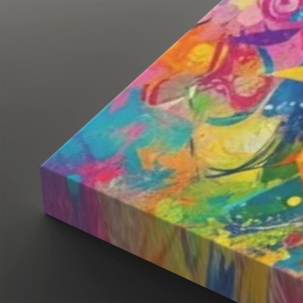 A rectangular canvas wall art print shown at an angle on a dark gray background, featuring a vivid abstract painting with swirling splashes of pink, blue, yellow, green, orange, and purple.