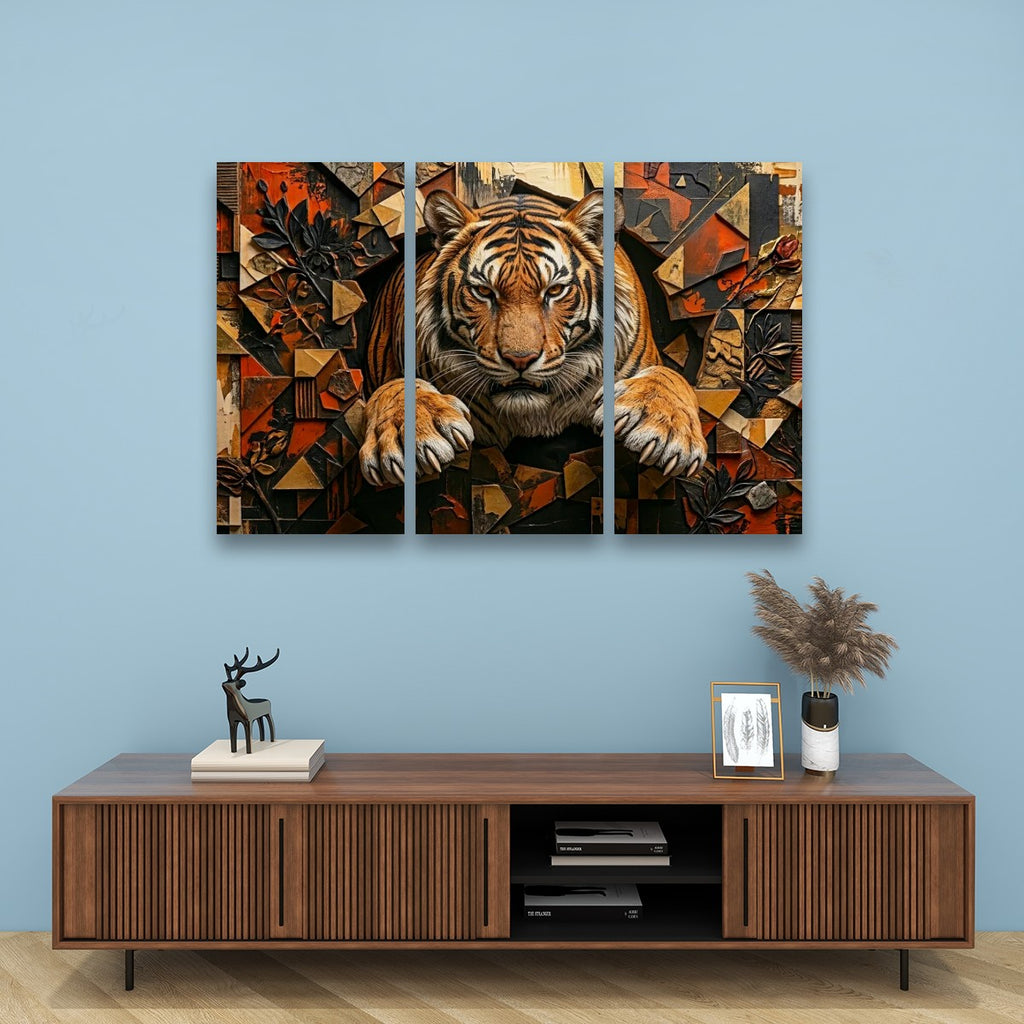 A three-panel canvas wall art set depicting a stylized tiger in warm geometric tones, displayed above a wooden console table against a light blue wall.