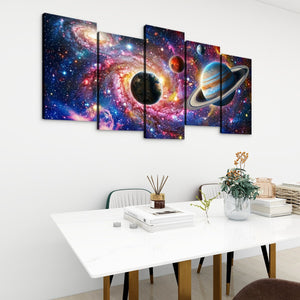 A 5-panel canvas wall art set depicting a vibrant outer space scene with planets, stars, and colorful nebulae, displayed on a white wall above a modern dining table.
