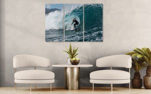 Modern living room with white chairs, a round table, and a wall with a large surfboard artwork.