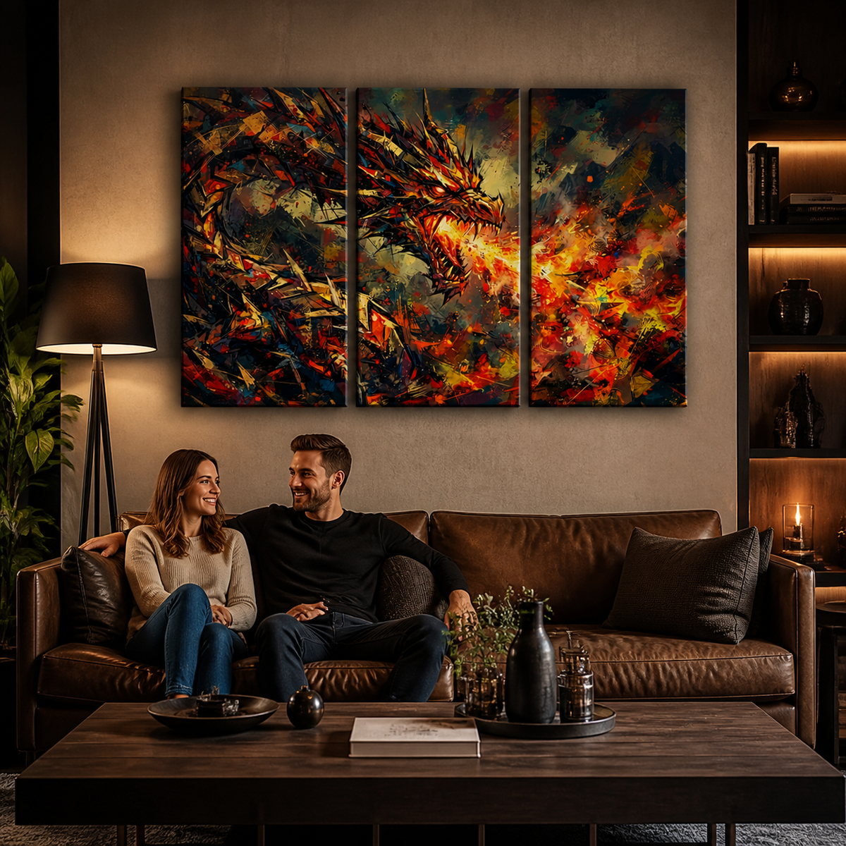 A three-panel canvas wall art set depicting a dramatic fiery dragon, displayed in a modern living room above a brown leather sofa with a couple sitting underneath.