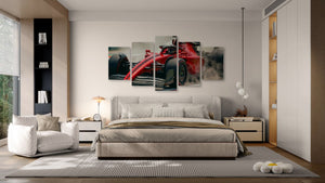 Modern bedroom with a large bed and wall art of a red car.