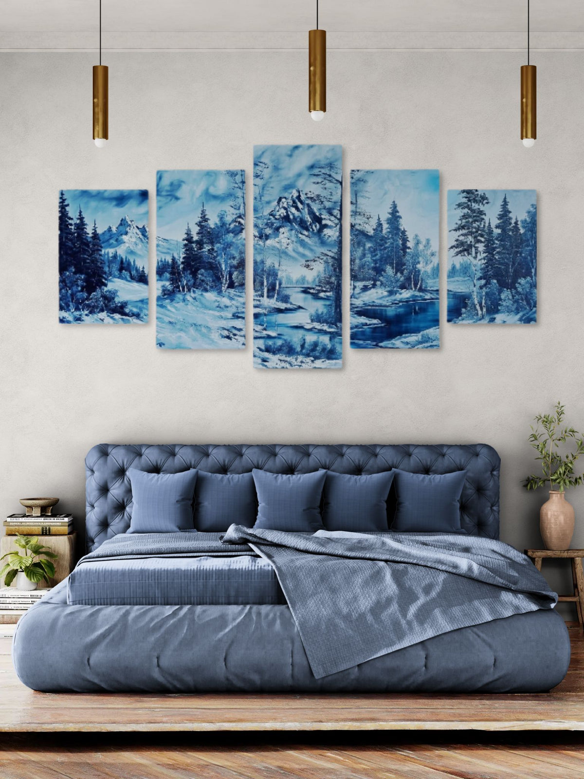 Five blue landscape paintings above a bed in a bedroom setting.