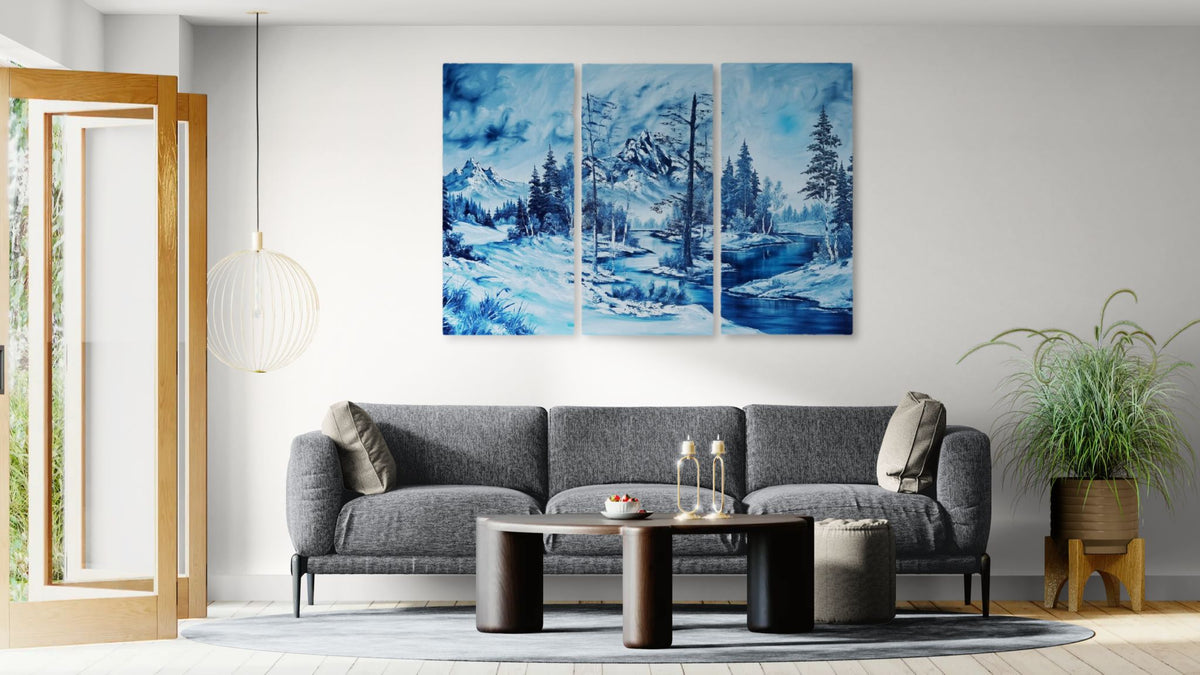 Modern living room with a gray sofa, coffee table, and decorative wall art.