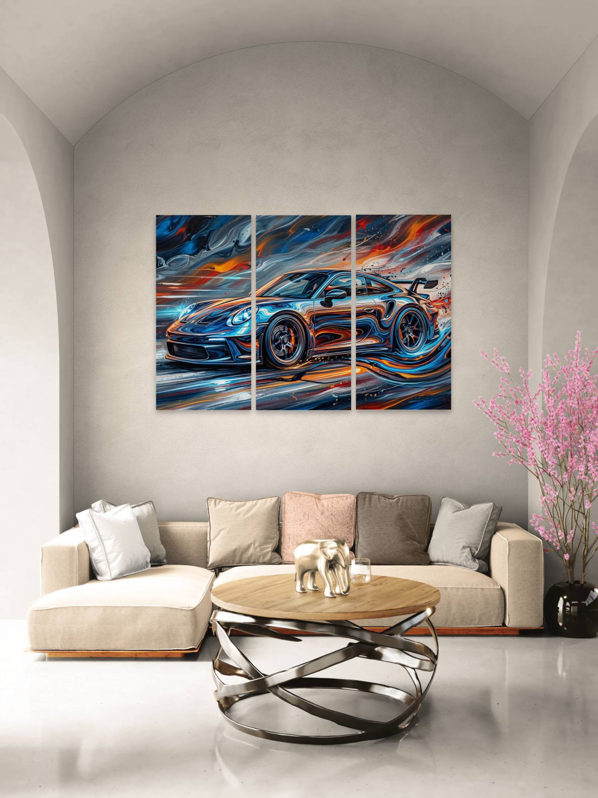 Modern living room with a triptych painting of a sports car on the wall.