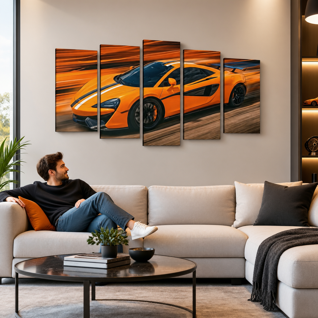 A man relaxes on a light beige sectional sofa in a modern living room, looking at a five-panel canvas wall art set depicting a bright orange  McLaren  sports car speeding across a blurred orange and brown background.