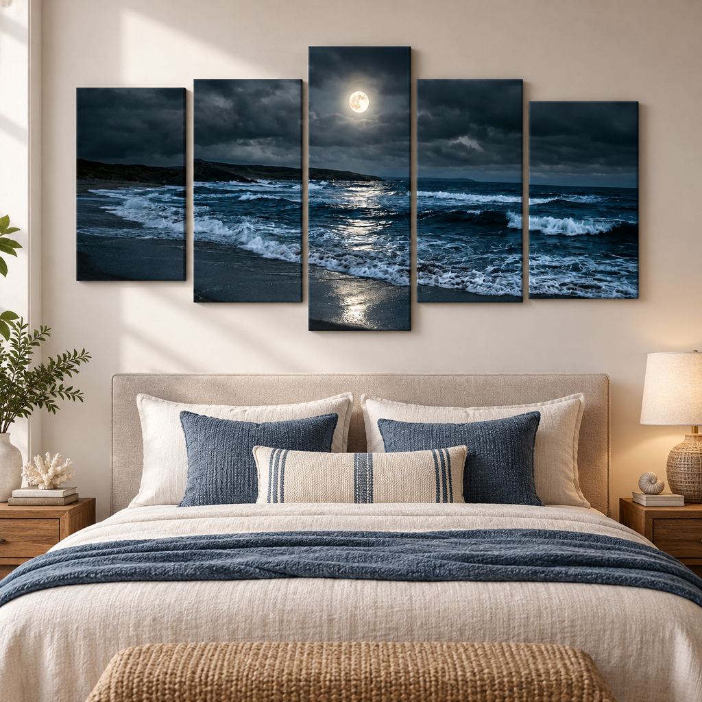 A five-panel canvas wall art set depicting a dramatic night ocean scene with waves, dark clouds, and a bright full moon, displayed above a neatly made bed in a modern bedroom setting.