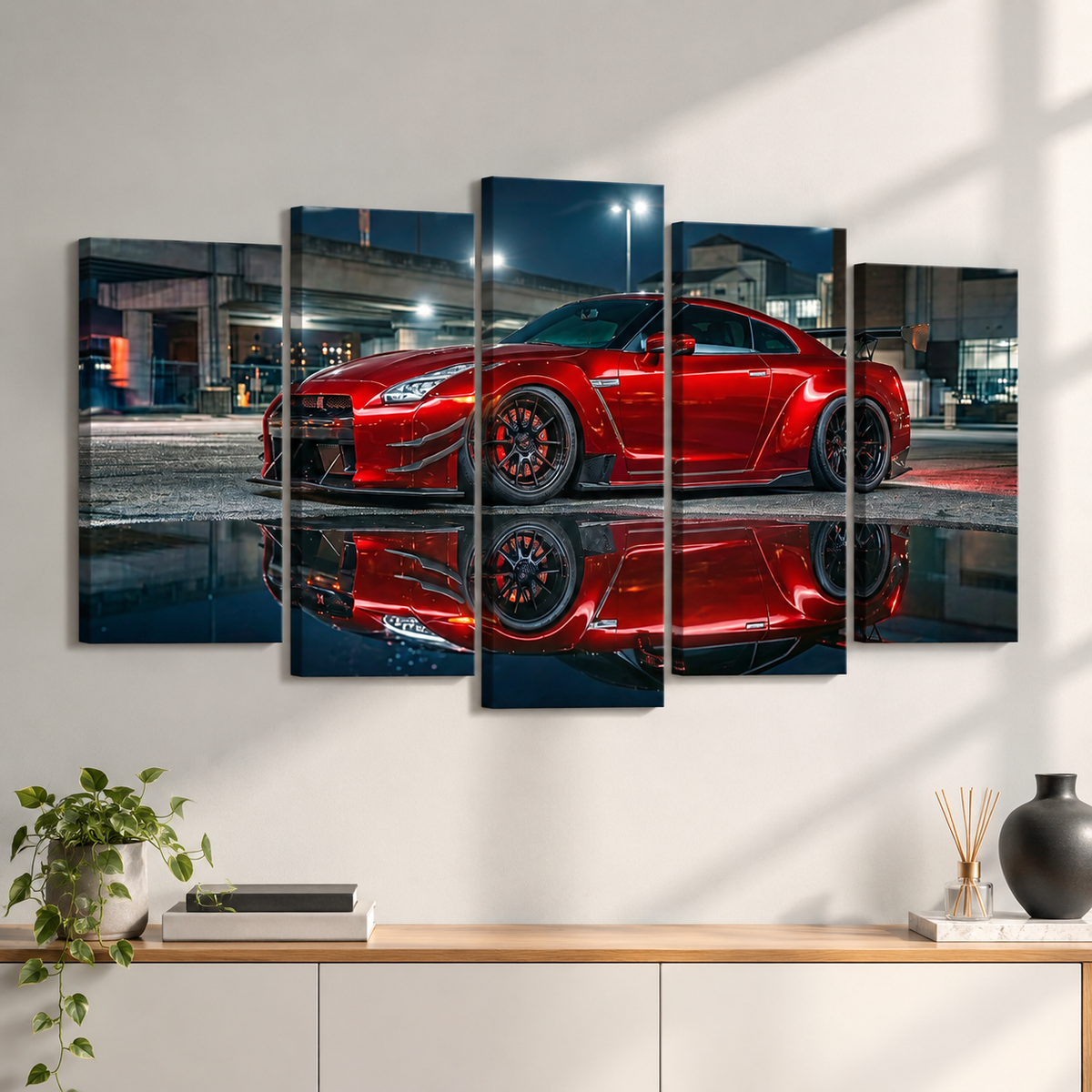 A 5-panel canvas wall art set depicting a red  Nissan GTR R35  sports car at night with its reflection on wet pavement, displayed on a white wall above a wooden console table with decorative items.