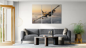 Living room with a gray sofa, coffee table, and wall art of a P2V airplane.