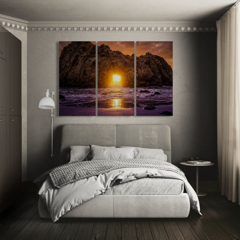 Bedroom with a large wall art of a sunset over water