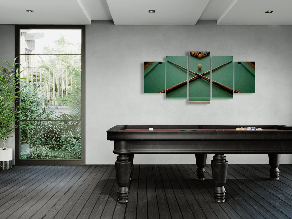 Modern room with a pool table and wall art depicting pool cues and balls.