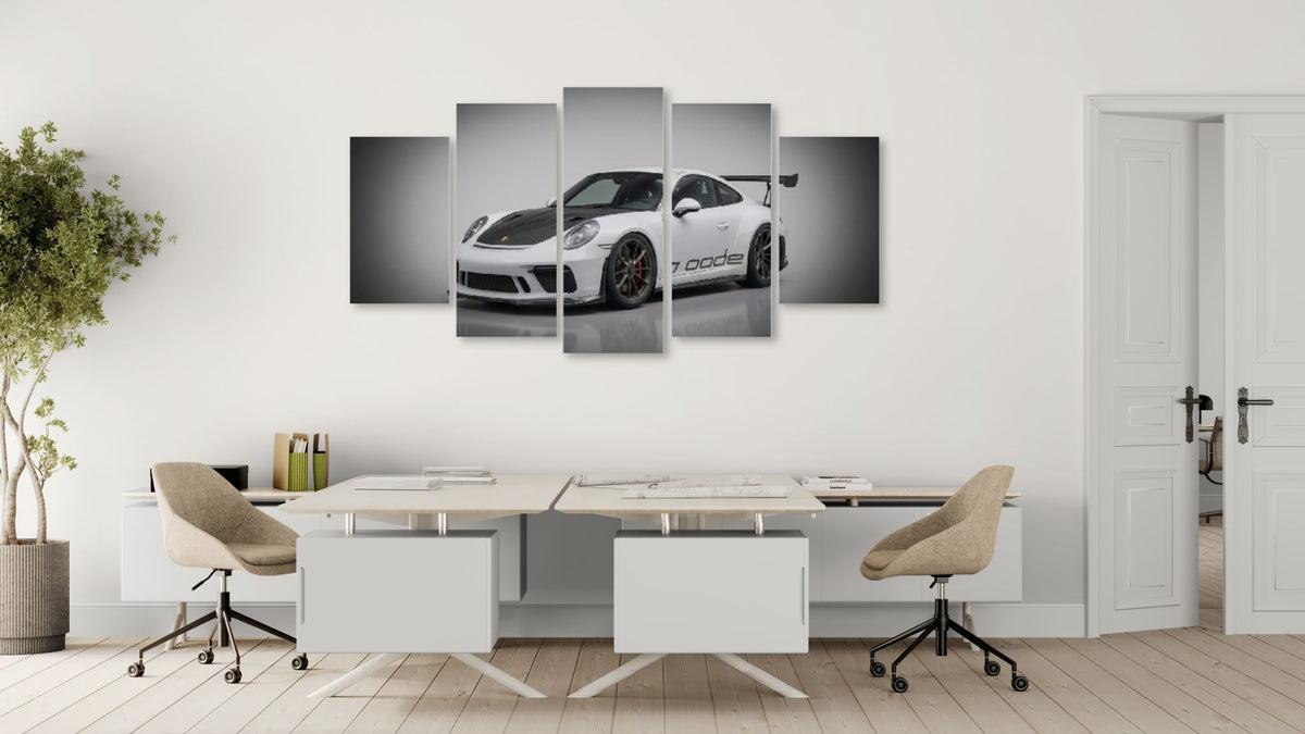 Modern office with a white porsche 911 gt3 991.2 generation car on a wall panel in the background