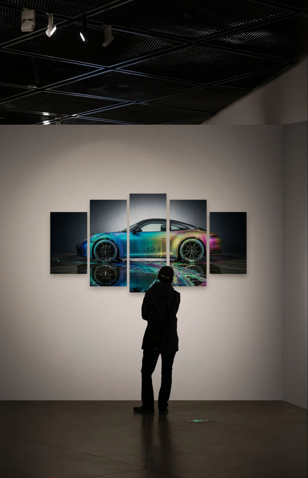 Person looking at a colorful Porsche 911 Sportscar painting on a wall