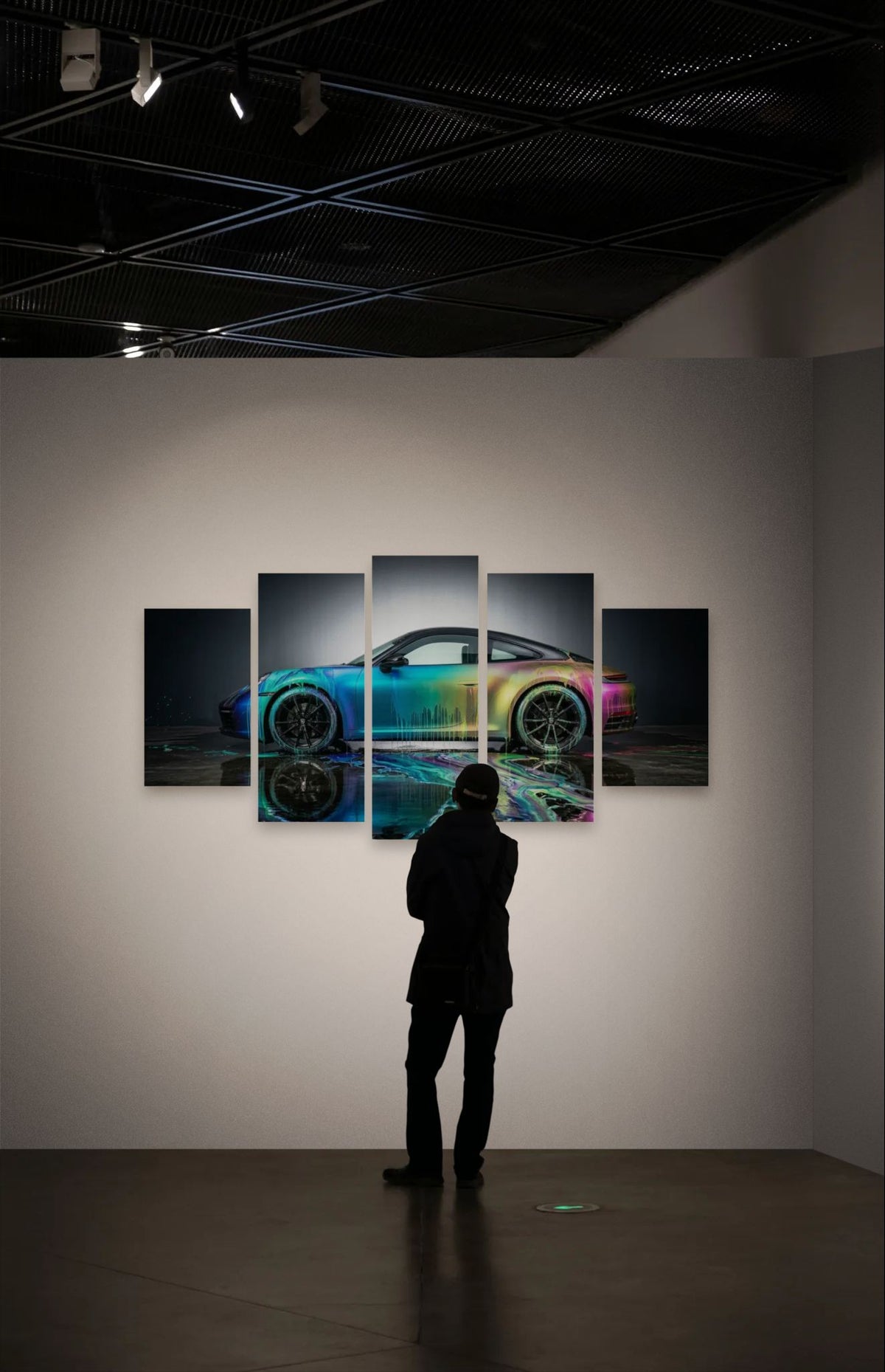 Person looking at a colorful Porsche 911 Sportscar painting on a wall