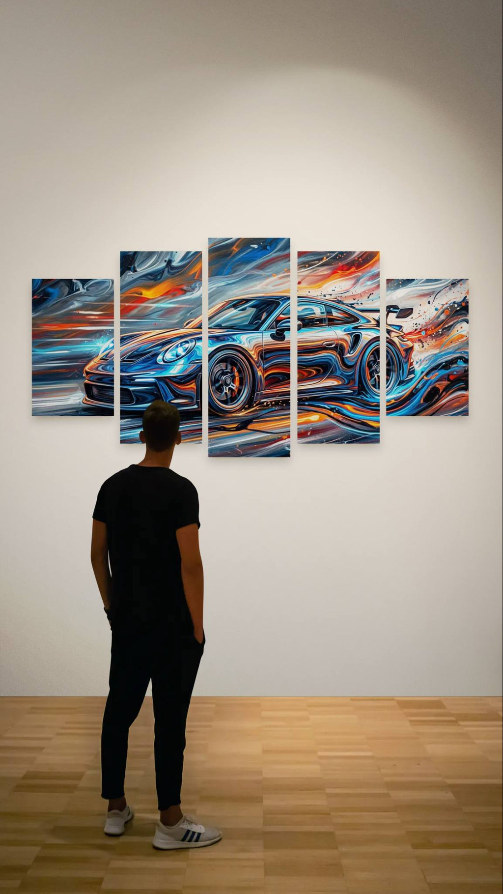 Man looking at a large abstract painting of a car on a wall