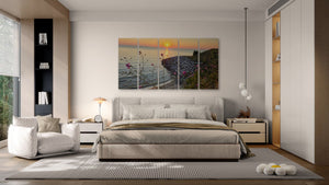 A modern bedroom featuring a five-panel canvas wall art set depicting a coastal sunset scene, hung above a bed with neutral beige and gray bedding.