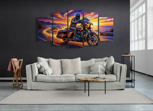 Five-panel wall art of a Harley-Davidson Street Glide motorcycle rider on a sunset road scene above a sofa.