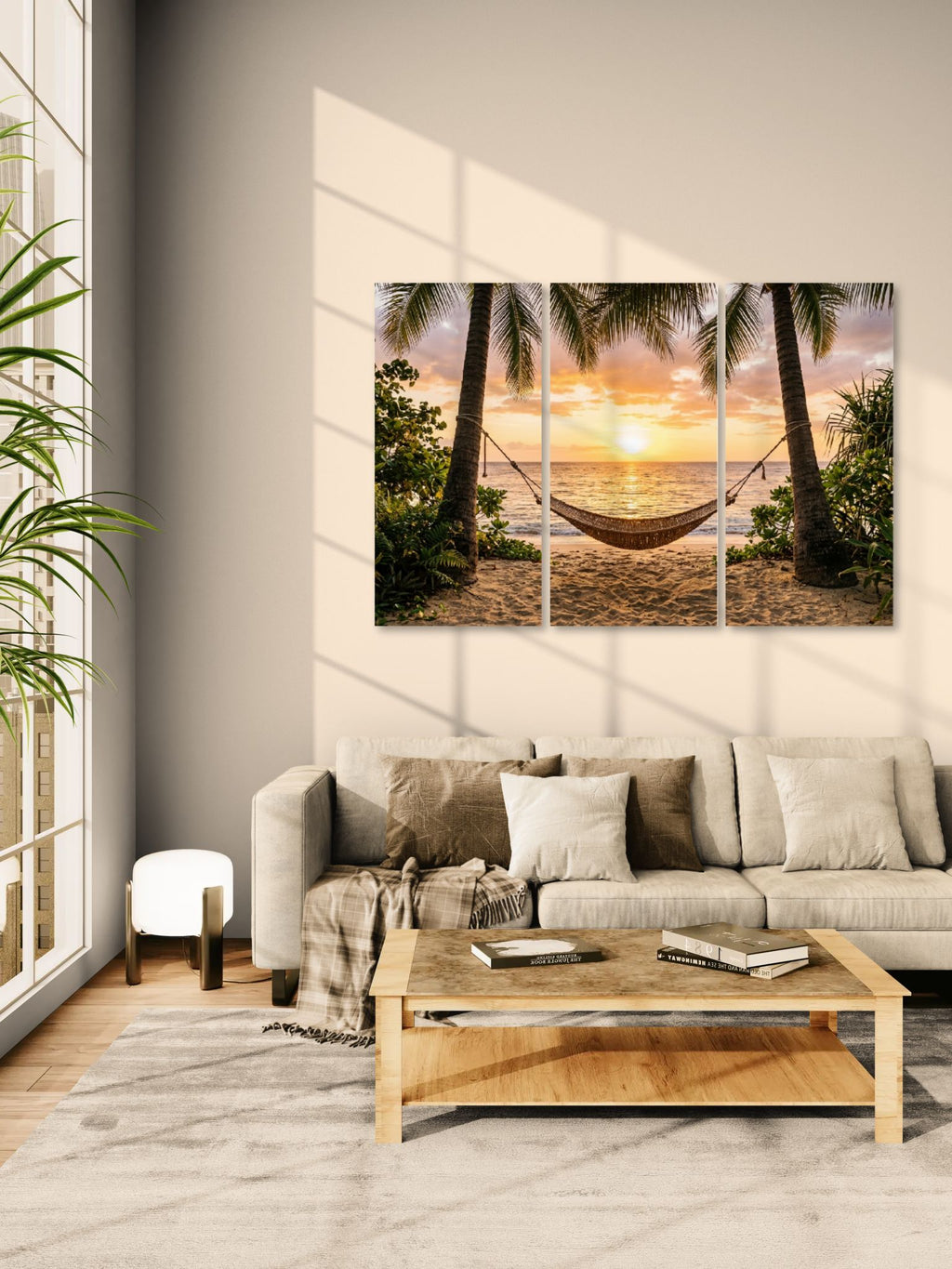 Living room with a large sofa, wooden coffee table, and wall art of a beach scene with a hammock.