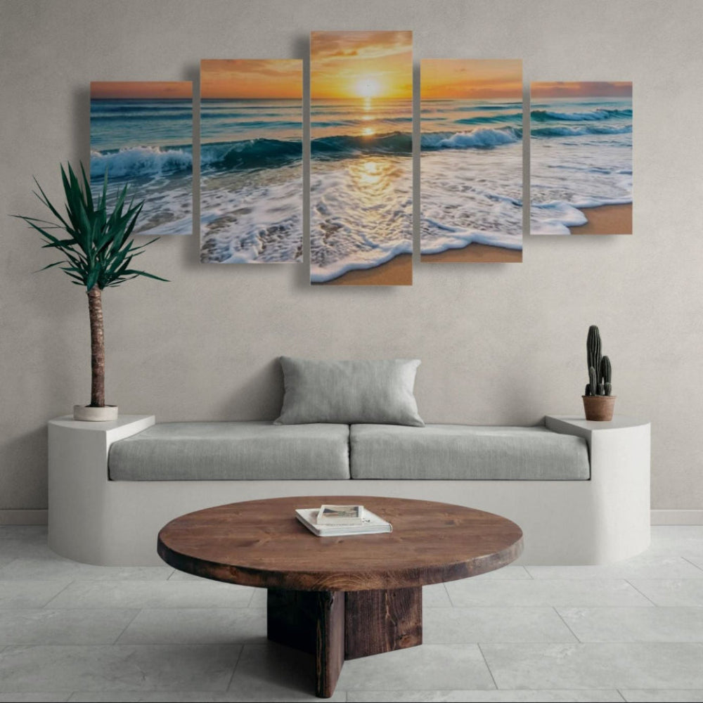 Living room with a large wall art depicting a sunset over the ocean, a sofa, and a wooden coffee table.
