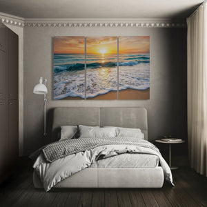 Bedroom with a large sunset over ocean painting on the wall
