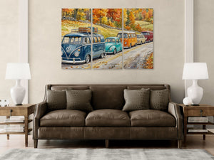 Three-panel artwork of vintage VW vans on a wall above a brown sofa.