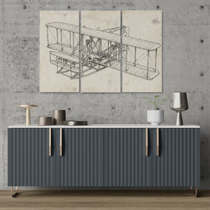 Modern interior with a gray sideboard, decorative items, and a large Wright Brothers airplane blueprint on the wall.