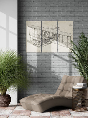 Modern interior with a chaise lounge, side table, and wall art of the Wright Brothers airplane design.