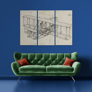 Green sofa with red cushions against a blue wall with the Wright Brothers airplane blueprint painting.